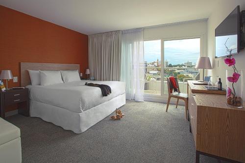 Giường trong phòng chung tại Mercure Montevideo Punta Carretas