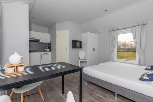 Postel nebo postele na pokoji v ubytování Resort Land & Zee