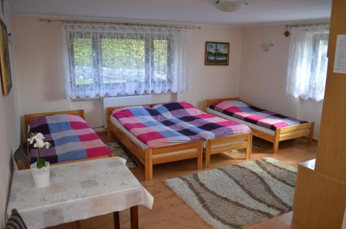 Postel nebo postele na pokoji v ubytování Pokoje gościnne - MAGNOLIA