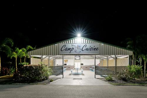 a carolina cottage at night with a light on top at Queens Beach Tourist Village in Bowen