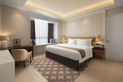 Sutasoma Hotel tesisinde bir odada yatak veya yataklar