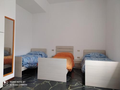 מיטה או מיטות בחדר ב-CASA VACANZE LUNA
