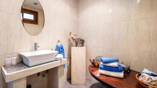 a bathroom with a sink and a mirror at Hotel La Casa in Torrox