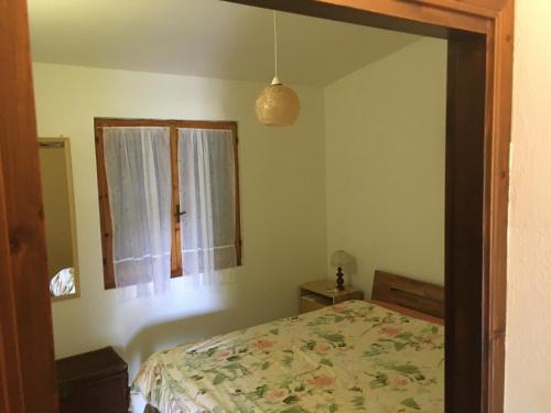 A bed or beds in a room at Eden Beach, trilocale con giardino a pochi passi dal mare