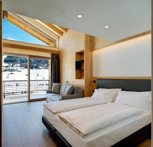 Tempat tidur dalam kamar di Vetta Alpine Relax