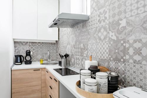 a kitchen with a sink and a counter top at HostGost Selected Suites - Molerova 9 in Belgrade