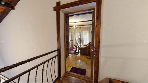 a hallway with a door leading to a living room at Chalet Vedmezhe in Polyana