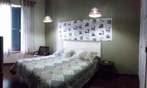 Tempat tidur dalam kamar di Residencial Flor- Hilda
