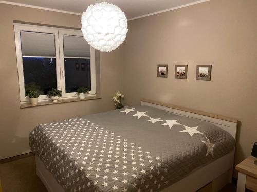a bedroom with a bed with stars on it at Ferienwohnung Beselin in Beselin