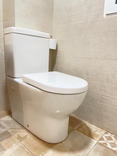 a bathroom with a white toilet in a room at Bertoko Urdaibai II in Bermeo