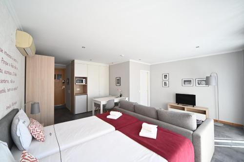 Famous Crows Lisbon Suitesにあるベッド
