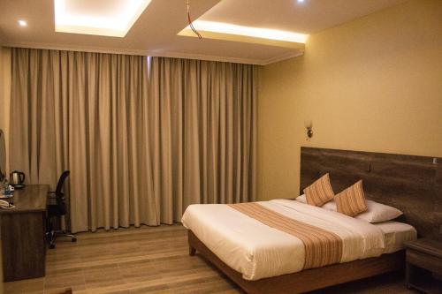 Ένα ή περισσότερα κρεβάτια σε δωμάτιο στο The Willis Hotel, Bomet