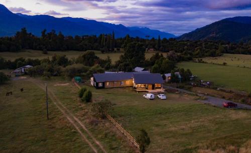 an aerial view of a house in the middle of a field at Vuelta al Sur in Puelo