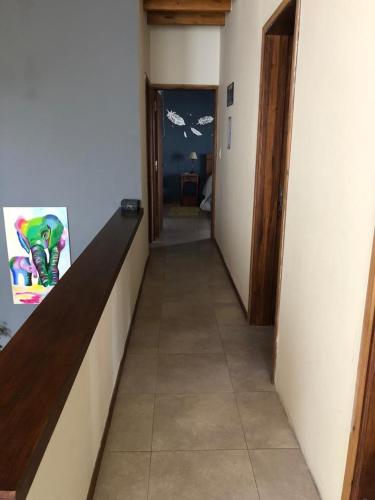 a hallway leading to a room with a hallwayasteryasteryasteryasteryasteryasteryastery at departamento confortable in Ciudad Lujan de Cuyo