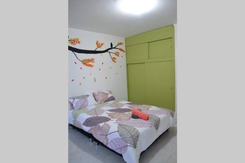 Кровать или кровати в номере The Nest House - Acogedor apartamento en Duitama