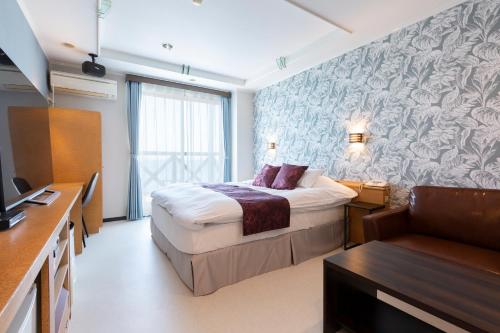 Ένα ή περισσότερα κρεβάτια σε δωμάτιο στο Hotel Liberty Matsuyama (Adult Only)