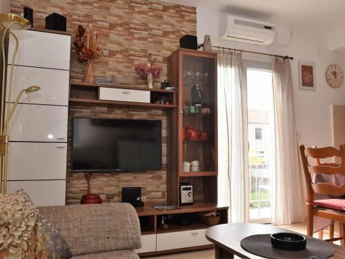 Televiisor ja/või meelelahutuskeskus majutusasutuses Apartment Manigo