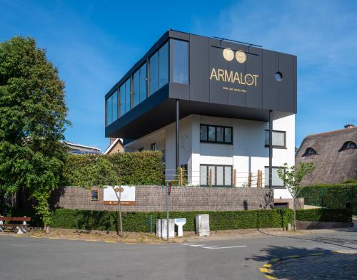 a building with an amazon sign on top of it at B&B Armalot by Julia in De Panne