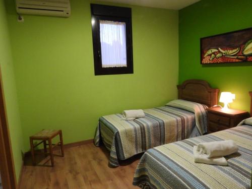 Giường trong phòng chung tại Villa Paraiso