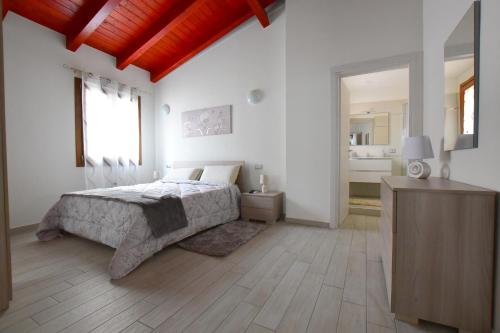 A bed or beds in a room at B&B La Genuina