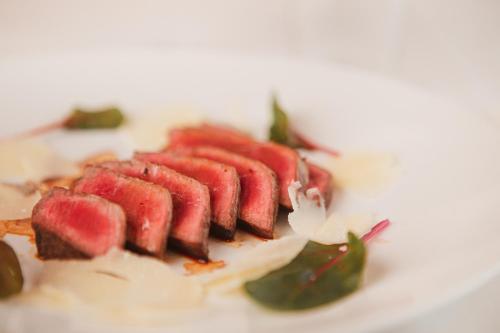 a bunch of food on a white plate at Agriturismo Il Capitolo in Carpaneto Piacentino