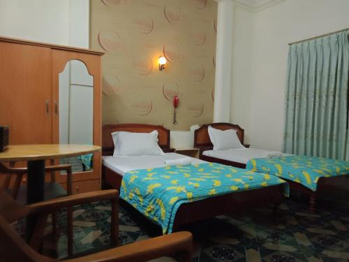 Ein Bett oder Betten in einem Zimmer der Unterkunft Khách sạn Duy Hoàng