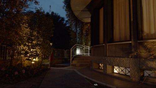 a night view of a building with stairs and a building at Villa Mase in Ravenna