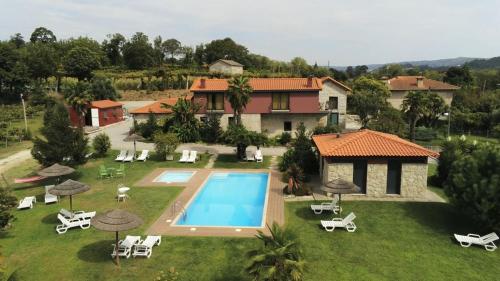 an aerial view of a house with a swimming pool at Quinta Lama de Cima in Fafe