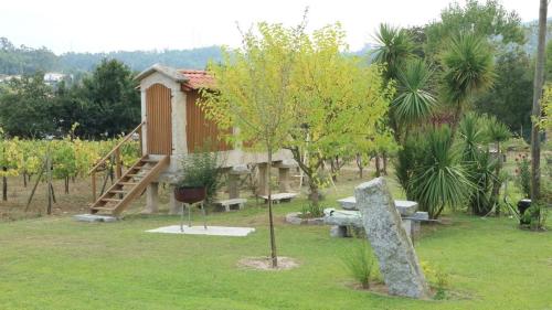 a small house in a park with a playground at Quinta Lama de Cima in Fafe