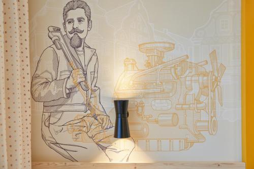 a drawing of a man with a microphone next to a machine at McDreams Hotel Ingolstadt in Ingolstadt