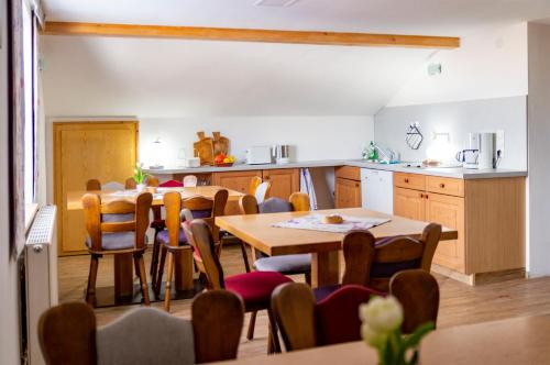 a kitchen and dining room with a table and chairs at Haus Kranzusch in Sonthofen