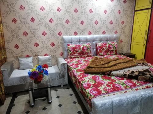 Katil atau katil-katil dalam bilik di Faizan Hotel