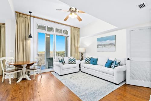 
a living room filled with furniture and a window at Sandestin Baytowne Wharf - Observation Point South #471 in Destin
