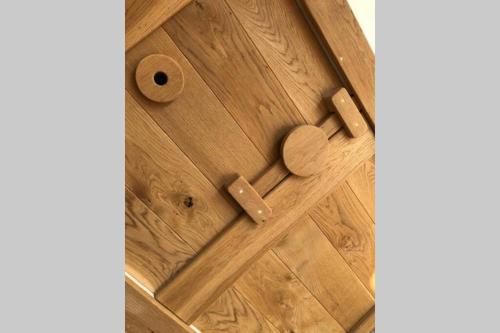 a wooden door with a heart on it at Wilderness Lodge in Oswestry