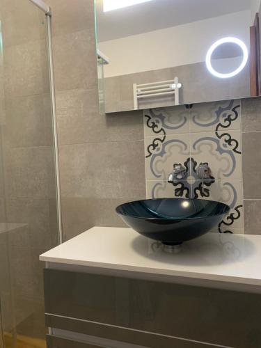 a bathroom with a blue bowl sink on a counter at Quinta da Luz - A Luxury Boutique B&B in Silves