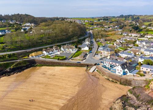 an aerial view of a town with a sandy beach at Seacliff Holiday Homes No 8 by Trident Holiday Homes in Dunmore East