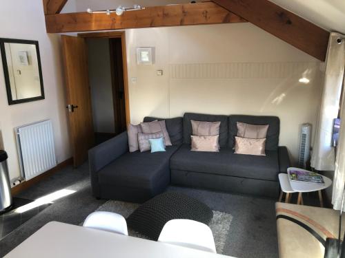 a living room with a couch and a table at Beacon View in Penrith