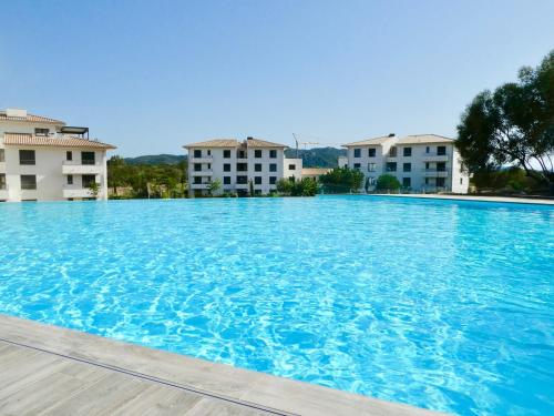 Photo de la galerie de l'établissement Domaine Arca T2 neuf standing piscine tennis, à Porto-Vecchio