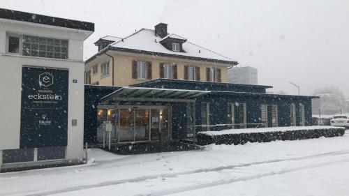 a building in the snow in a city at Dialoghotel Eckstein in Zug