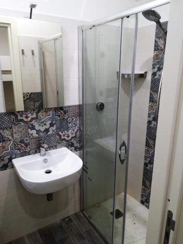 a bathroom with a sink and a shower at B&B Marconi in Favignana