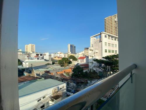 a view of a city from a balcony at Dear House near Bai Sau beach in Vung Tau