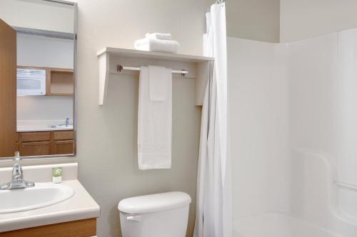 A bathroom at WoodSpring Suites Baton Rouge Airline Highway