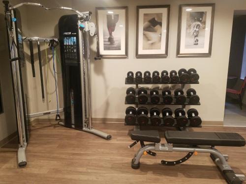a gym with a rack of dumbbells at Staybridge Suites Indianapolis-Fishers by IHG in Fishers