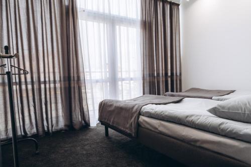 Postel nebo postele na pokoji v ubytování Готель хостел Rooms
