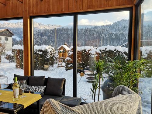 a room with a view of the snow covered mountains at Osada Kotarz in Brenna