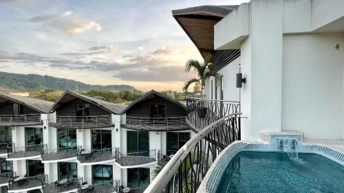 a view from the balcony of a hotel with a swimming pool at Luxury SKY PENTHOUSES 3-6BR Condo-Hotel at Oceano Jaco in Jacó