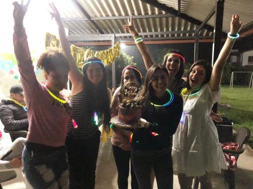 a group of girls holding up a trophy at Paraiso Cocora in Salento