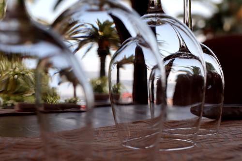 a row of wine glasses sitting on top of a table at Hôtel Rembrandt in Tangier