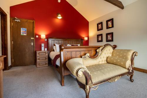 Ένα ή περισσότερα κρεβάτια σε δωμάτιο στο The Village Inn