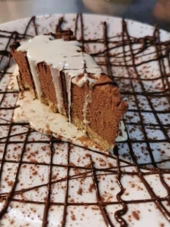 a piece of chocolate cake on a cooling rack at The Village Inn in Longframlington